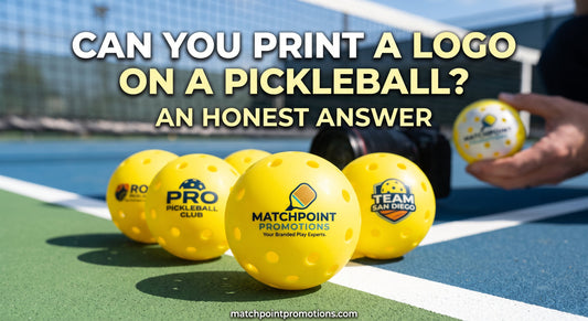 Yellow pickleballs printed with custom logos on a court