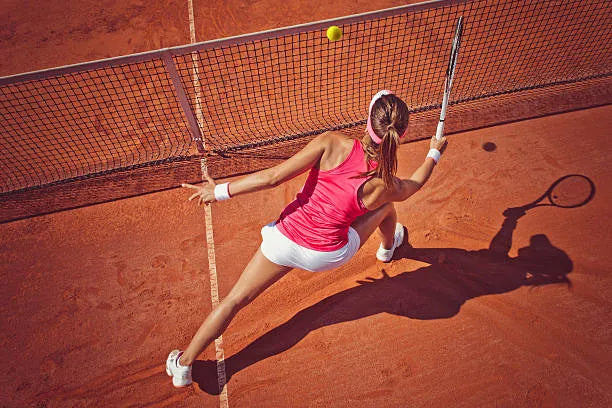 Tennis player on court preparing to serve with a fresh set of tennis balls