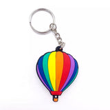 Custom keychain shaped like a rainbow-striped hot air balloon.