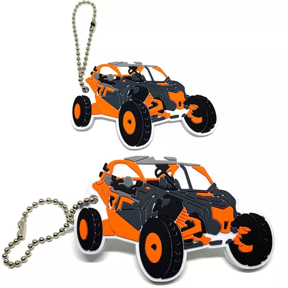 Two custom keychains shaped like an orange and black off-road buggy on ball chains.
