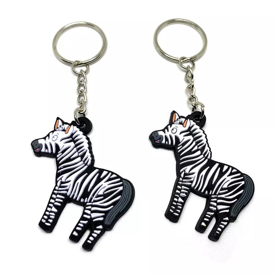 Two custom keychains shaped like a cartoon zebra.