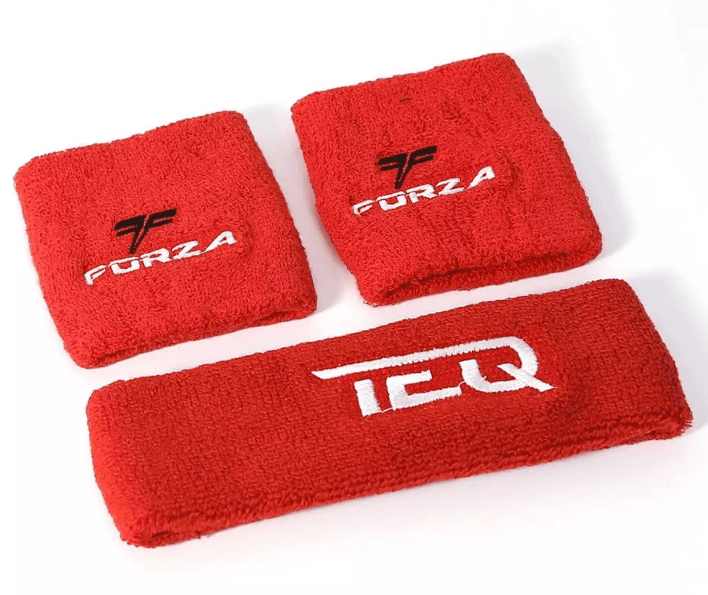 Two red custom terry cloth wristbands embroidered with a Forza logo beside a matching headband.