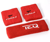 Two red custom terry cloth wristbands embroidered with a Forza logo beside a matching headband.