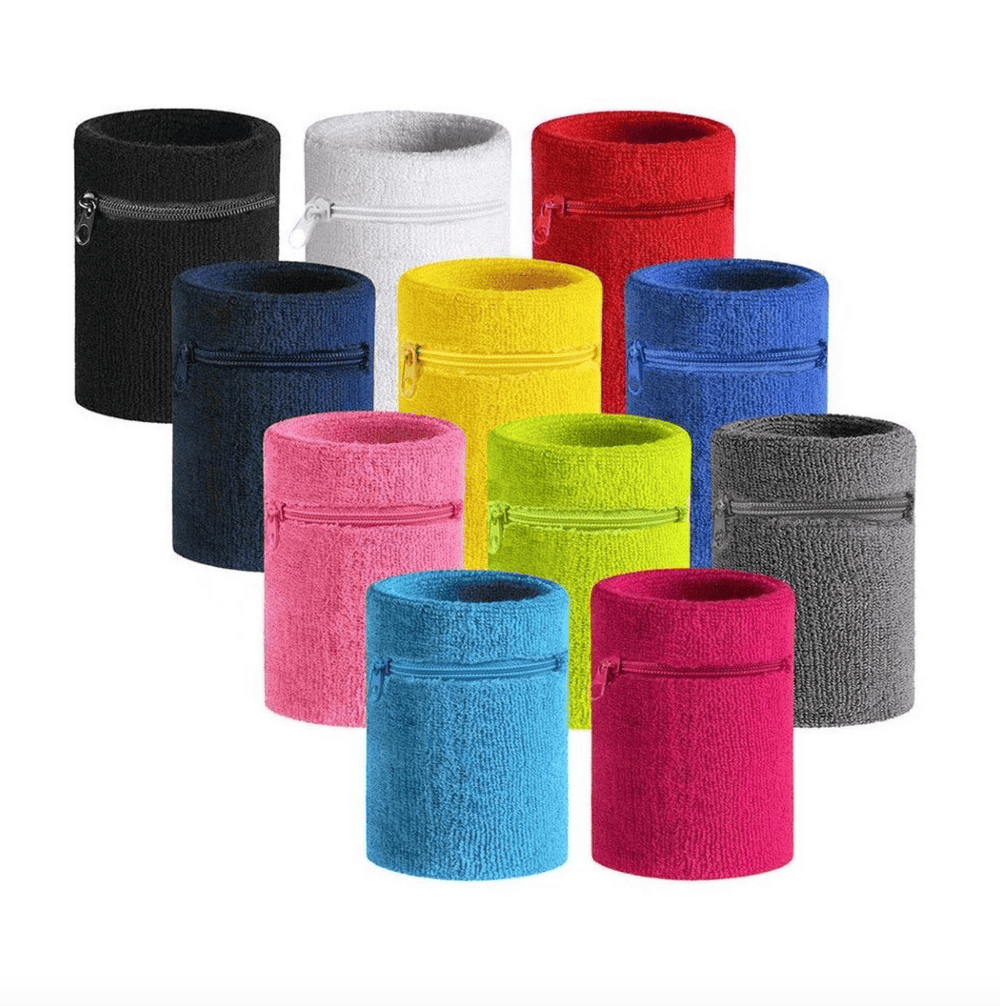 An assortment of terry cloth wristbands with zippered pockets in a range of colors.