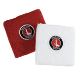 Red and white custom terry cloth wristbands embroidered with a Charlton Athletic crest.