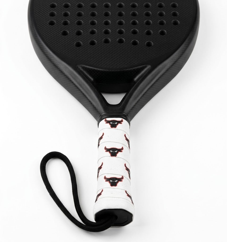 Padel racket with a white custom overgrip printed with a repeating black and red bull head logo.