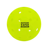 Custom pickleball printed with a tournament logo in black