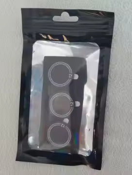 Three pickleball paddle cap weights packaged on a card inside a resealable pouch.