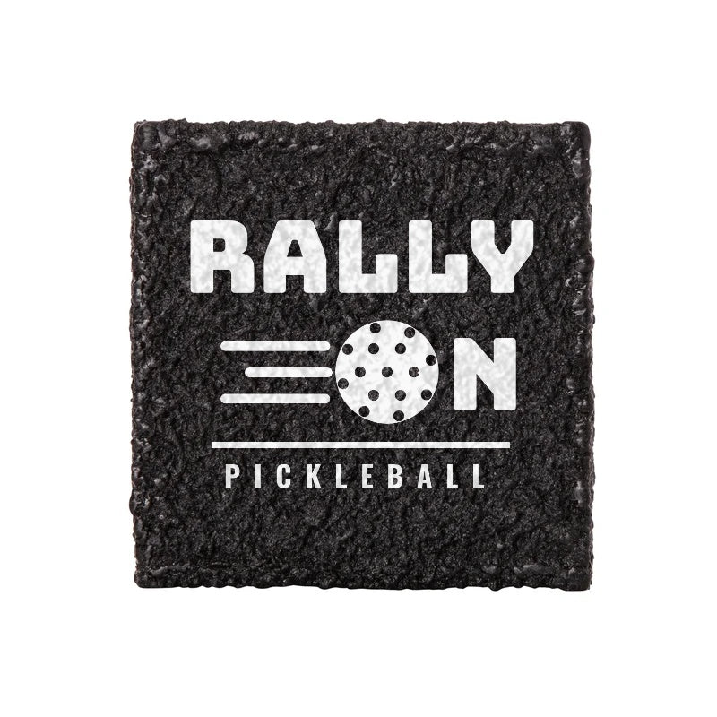 Black custom pickleball paddle eraser printed in white with a "Rally On Pickleball" design.