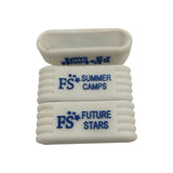 Grooved white pickleball bands with the client's summer camp logo, motto, and name.
