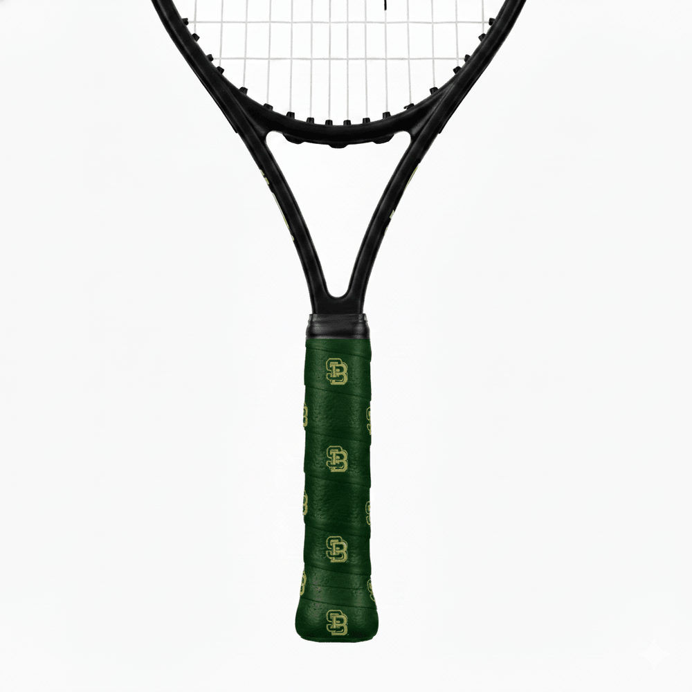 Green custom tennis overgrip with a repeating gold "SB" monogram on a black tennis racket handle.