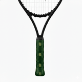 Green custom tennis overgrip with a repeating gold "SB" monogram on a black tennis racket handle.
